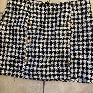 Houndstooth wool skirt with connected shorts. Ship same or next day.